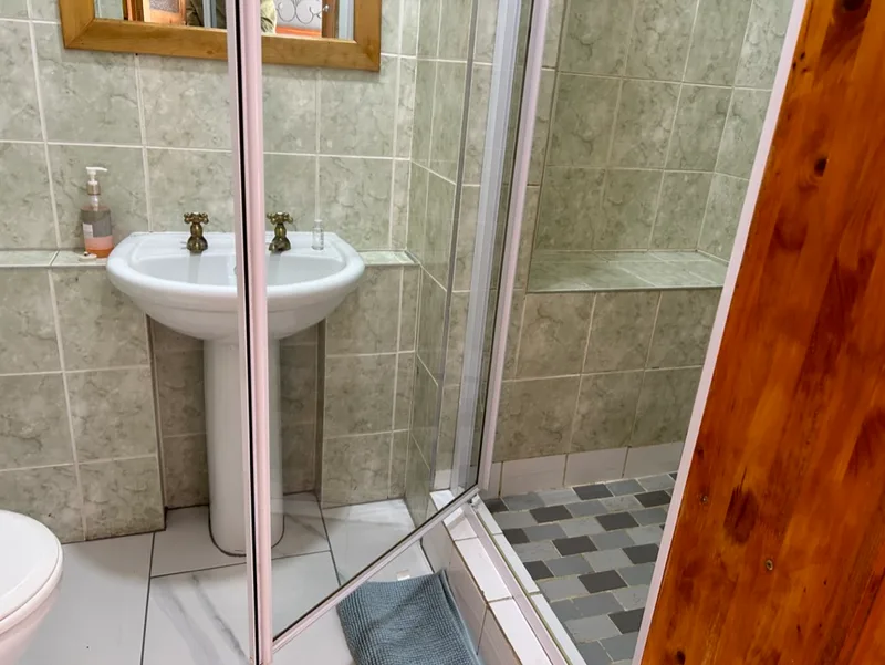 Wash basin and shower in Rooms 1 and 2