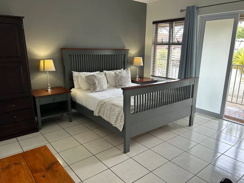 Queen-size bed in Room 7 at The Solomon