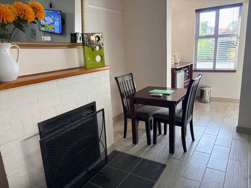 Table and chairs in Room 5 at the Solomon Edwardian Guest House