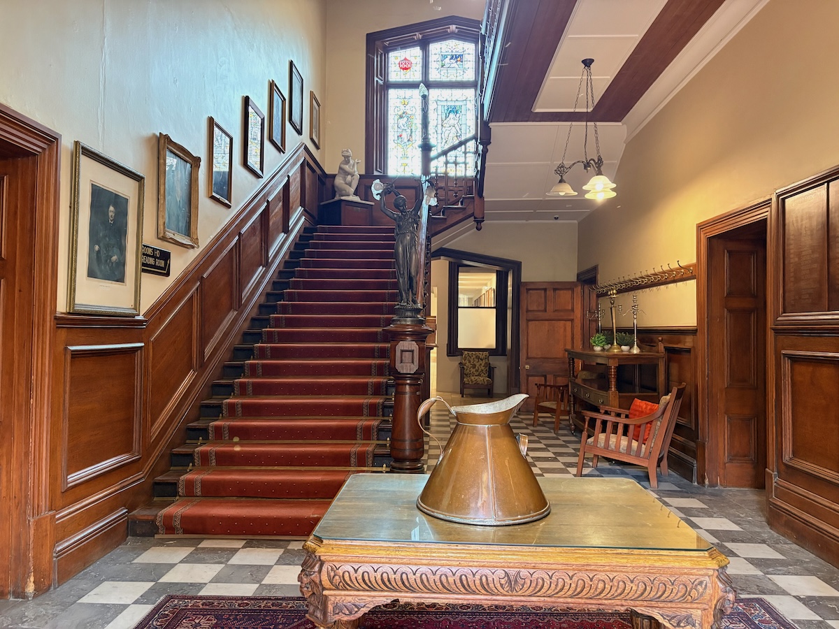 The magnificent double bend in the timber staircase, viewed from the ground floor.
