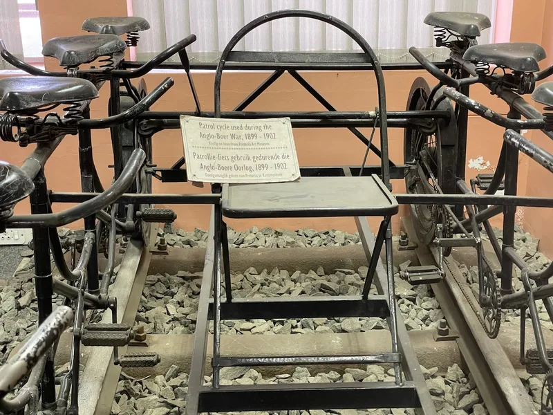 Close view of the saddles, pedals and metal framework of the Anglo-Boer War patrol cycle at the Kimberley Transport Museum. 