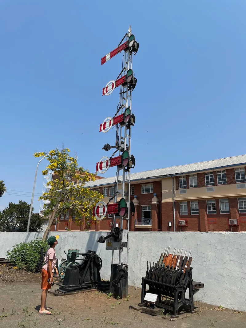 Historic semaphore railway signals beside the tracks at Kimberley Railway Station. 