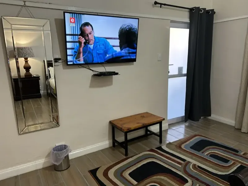 Watch TV in bed in Room 4 at The Solomon