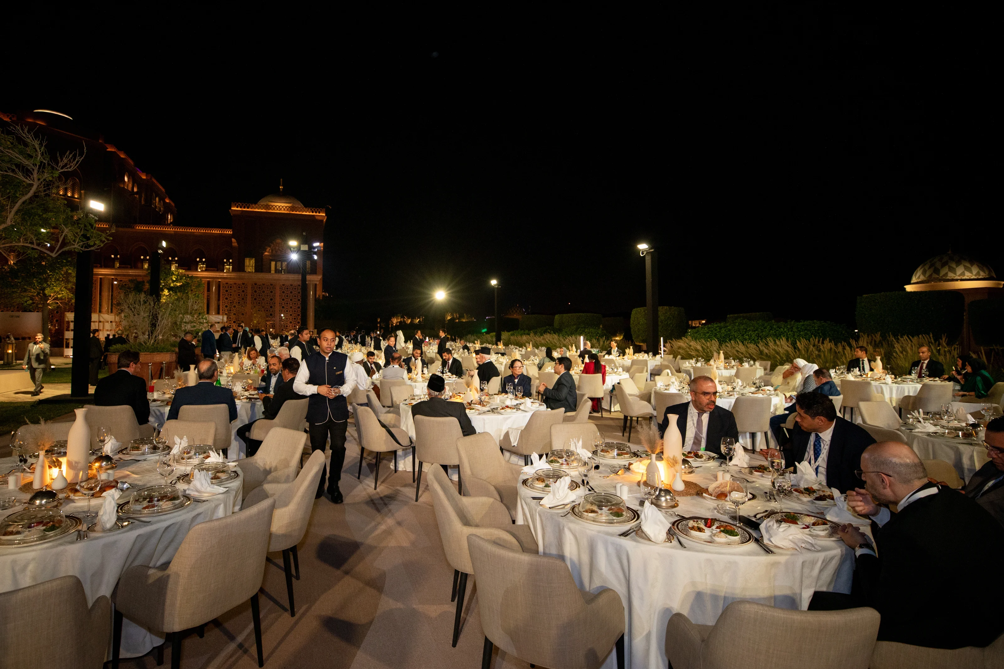 Beautifully styled banquet tables prepared for the Global Faith Leaders Gala Dinner