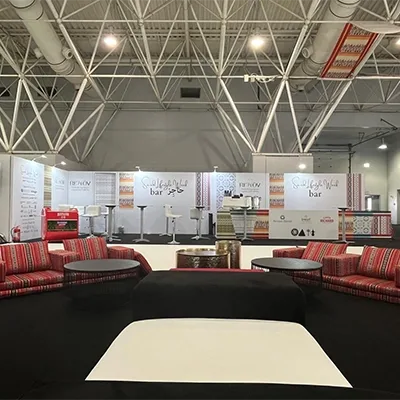 Cultural event hospitality lounge with traditional seating and Arabic-inspired styling