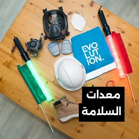 Personal protective equipment and fire safety items arranged on a table for event site operations.