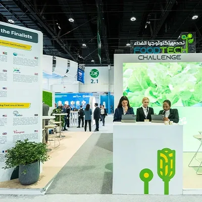 Custom scenic stage and exhibition fabrication delivered at ADNEC.