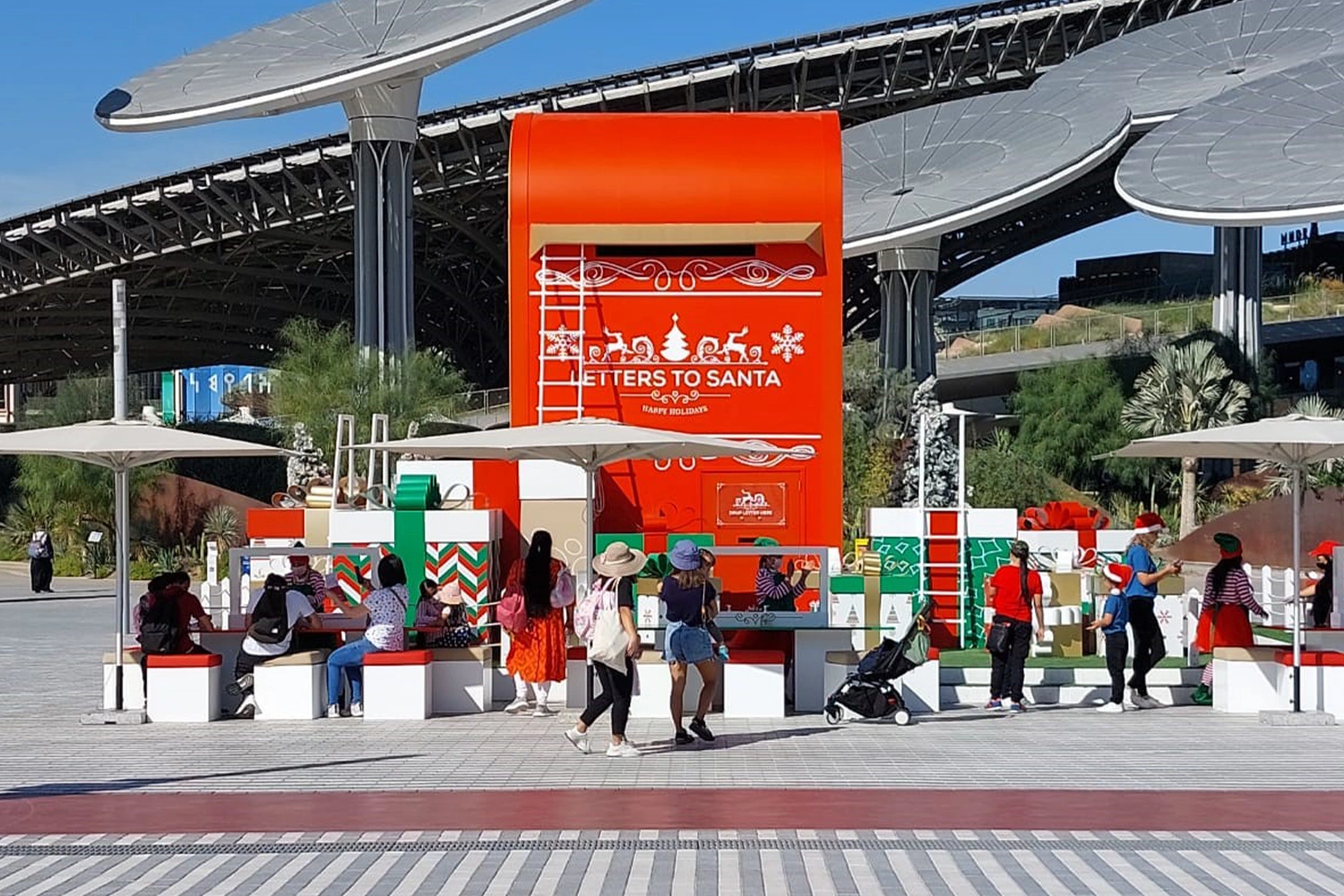 Large festive gift structures integrated into the temporary Christmas scenic environment in Dubai.