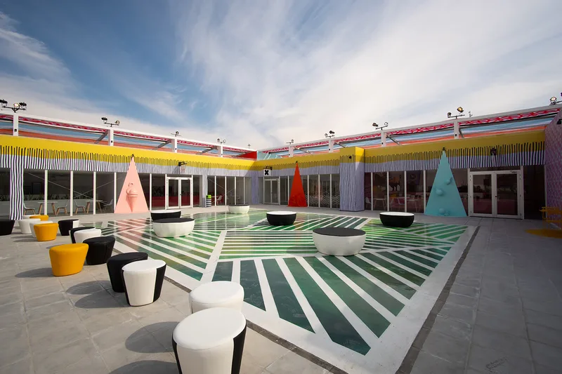 Colourful polyurethane-painted scenic flooring installed across the Diriyah Oasis temporary environment.