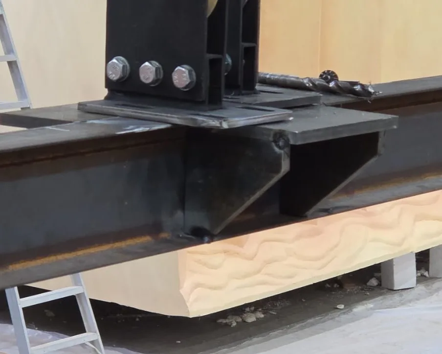 Scenic steel connection plate showing bolts, controlled welds and accurately aligned structural members
