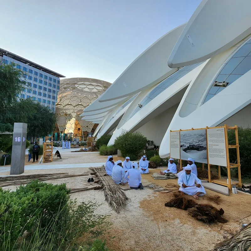 Date-palm craft display arranged within reusable timber scenic frames at Expo City.