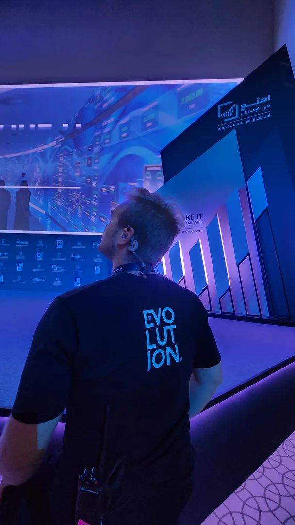 Evolution Scenic technician checking consistent perimeter gaps around an integrated broadcast LED display.