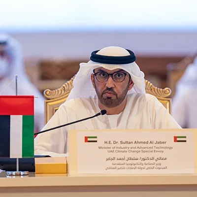 Branded delegate desk signage and UAE flag display for the UAE Regional Climate Dialogue.