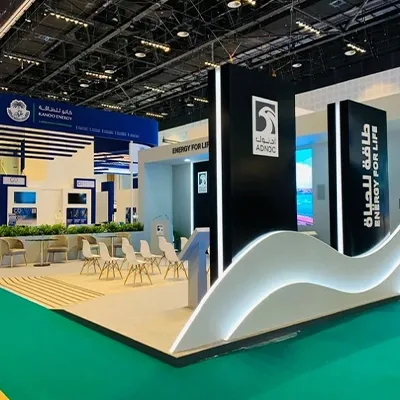 ADNOC Smart Manufacturing exhibition zone constructed with custom scenic walls and digital displays
