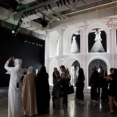 Bespoke gallery construction supporting luxury fashion exhibition displays.