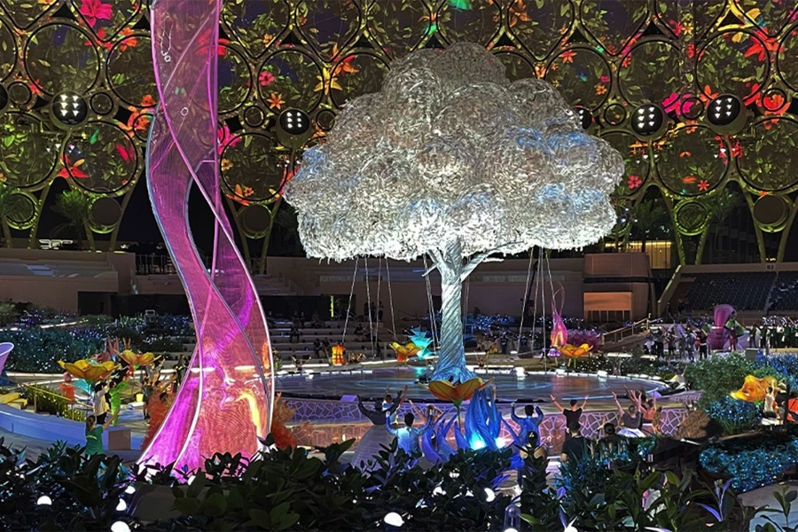 Image descriptiovolution Scenic kinetic floral scenery arranged around the Expo 2020 central stage.n
