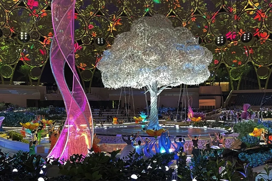 Image descriptiovolution Scenic kinetic floral scenery arranged around the Expo 2020 central stage.n