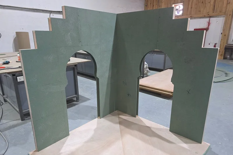 Reinforced edge detail on a reusable scenic panel designed for repeated handling