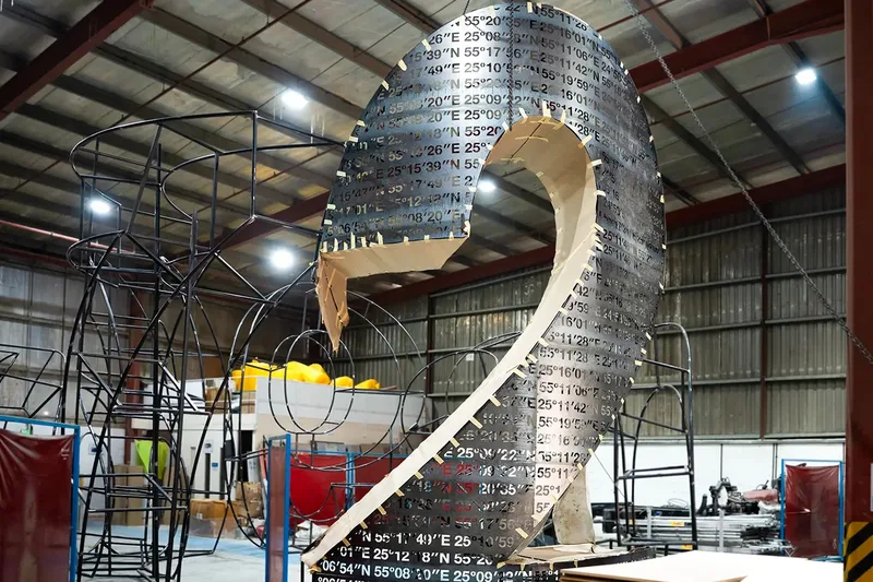 Tall scenic tower divided into transportable structural and cladding sections