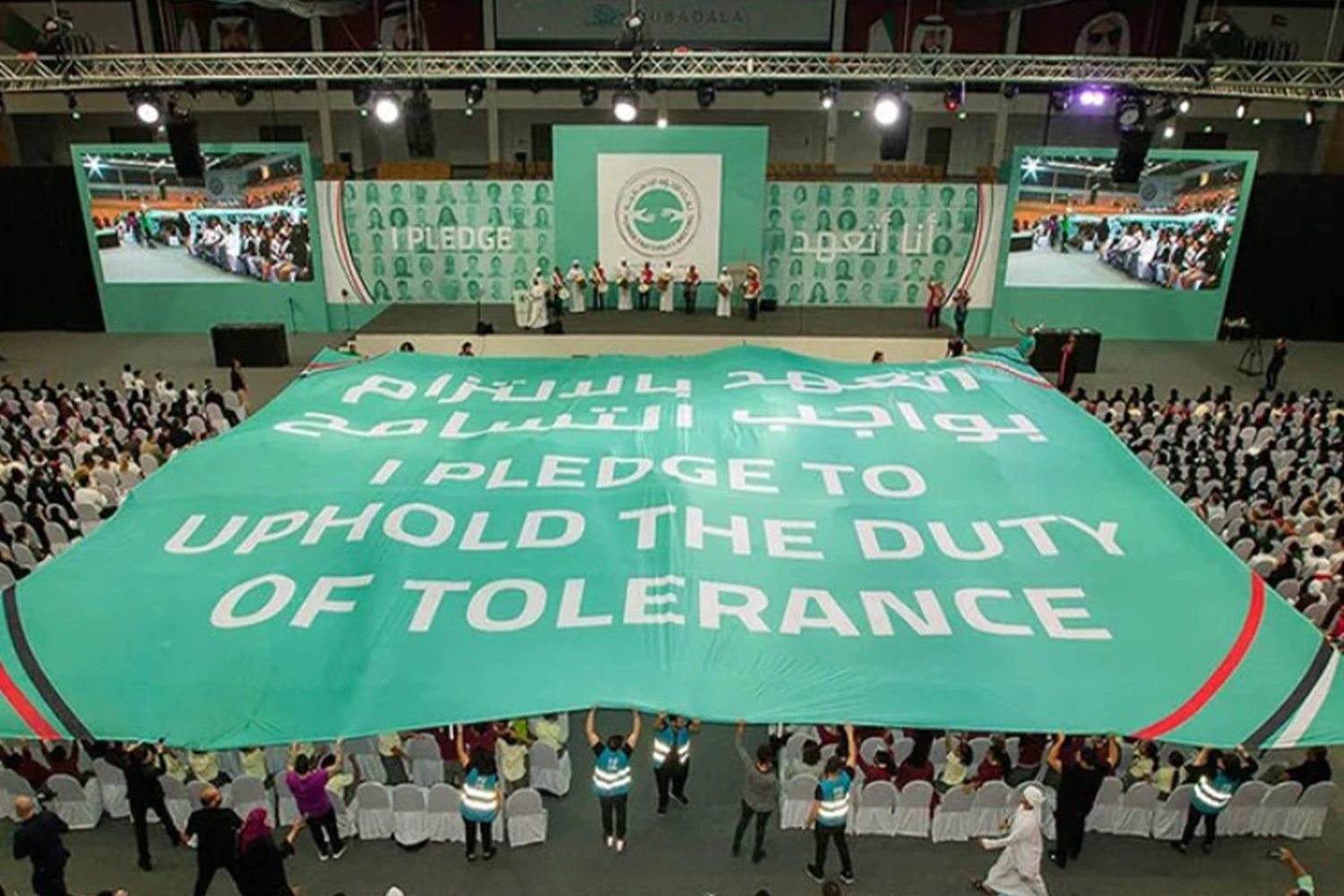 Evolution Scenic integrated stage and branded backdrop for the Youth Tolerance Rally in Abu Dhabi.