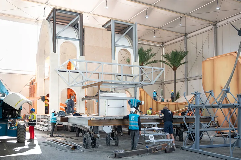 Large scenic structure split into transportable modules with bolted connections visible between sections.