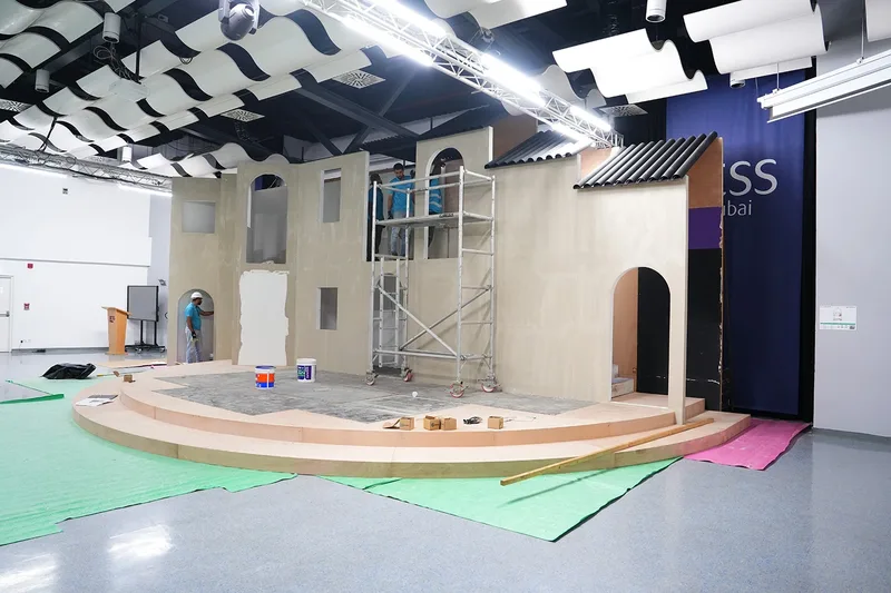 Scenic installation using protected flooring and non-marking handling equipment