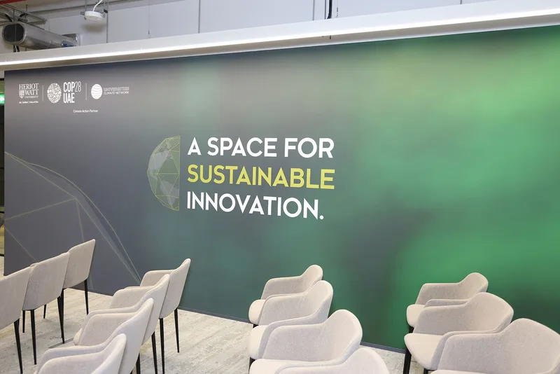Timber-framed MDF stage backdrop wrapped in printed fabric with Climate Hub graphics.