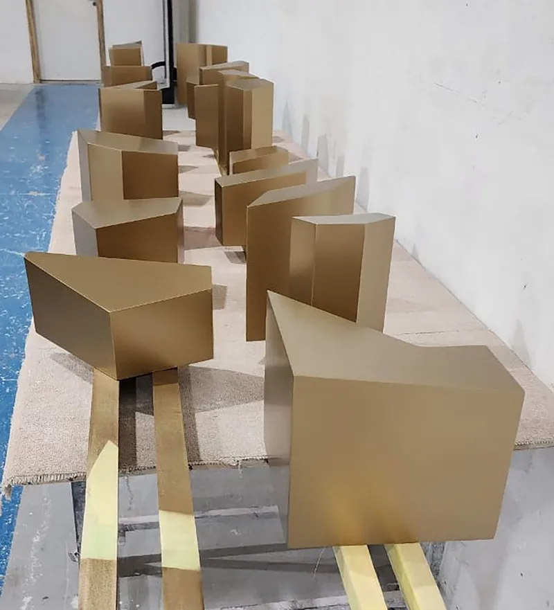 Precision fabricated geometric panels creating the three-dimensional KSA Pavilion identity.