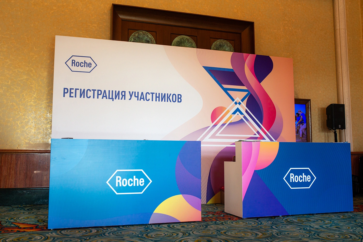 Evolution Scenic branded gala stage and scenic backdrop for Roche Dubai.