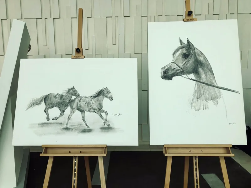 Client-supplied artwork presented on custom plinths within the gallery environment.