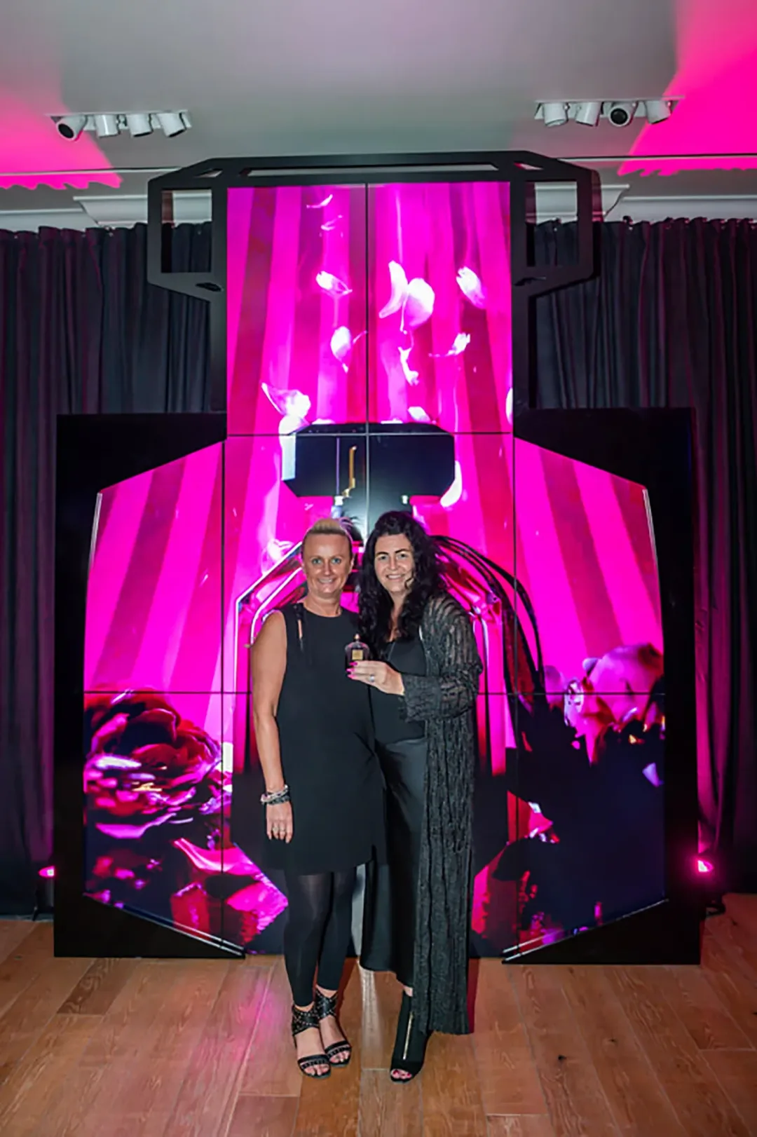 Integrated scenic fabrication and digital display elements forming the Victoria’s Secret Dubai launch installation.