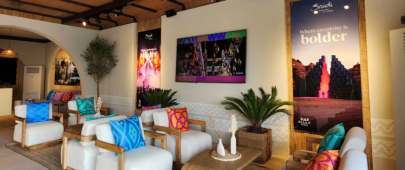 Evolution Scenic Visit Saudi hospitality tent with custom barasti ceiling and branded scenic walls.