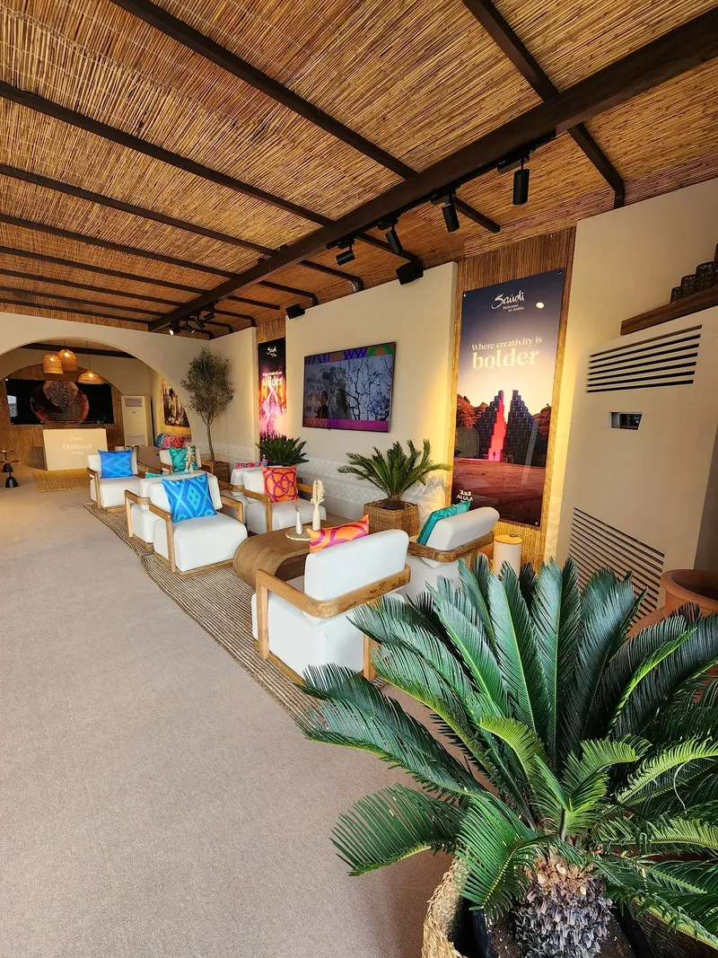 Four custom buffet counters integrated into the branded Visit Saudi scenic interior.