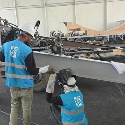 technicians-fabricating-steel-base-frame.webp