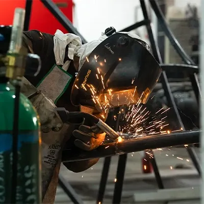welder-fabricating-metal-scenic-frame.webp