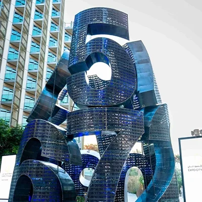 blue-metal-sculpture-urban-public-space.webp