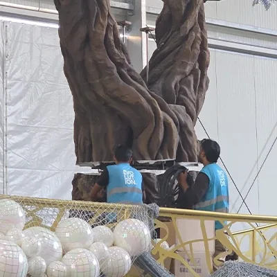 technicians-installing-sculpted-tree-prop.webp