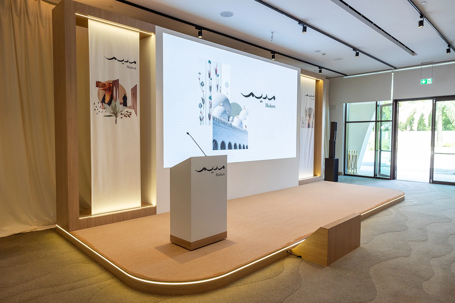 Medeem interactive stage with touch-screen kiosks and TV screens
