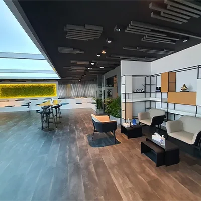 modern-office-lounge-workstations-greenery.webp