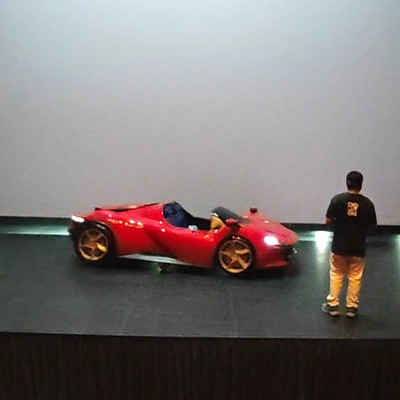red-race-car-on-stage.webp