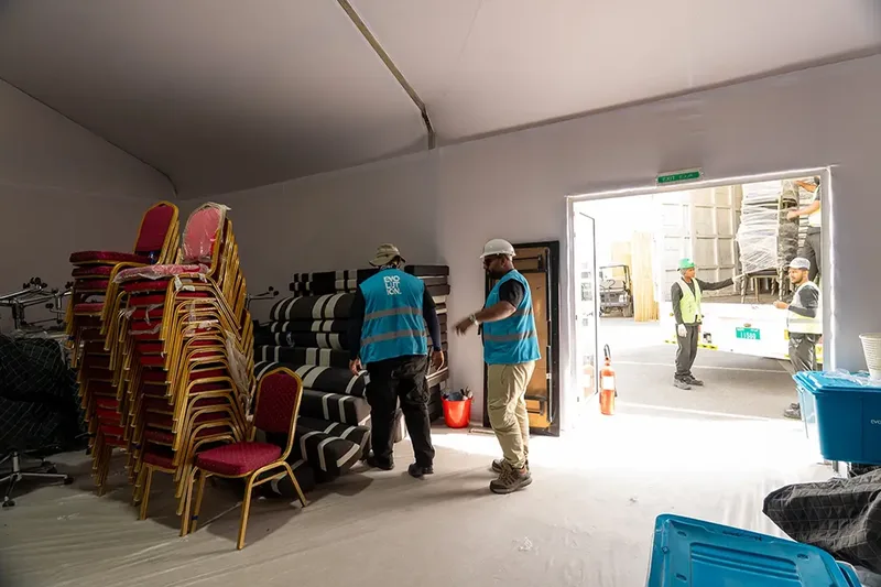 Evolution Site crew working inside a temporary operations structure