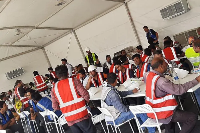 Workforce briefing inside a temporary event operations facility