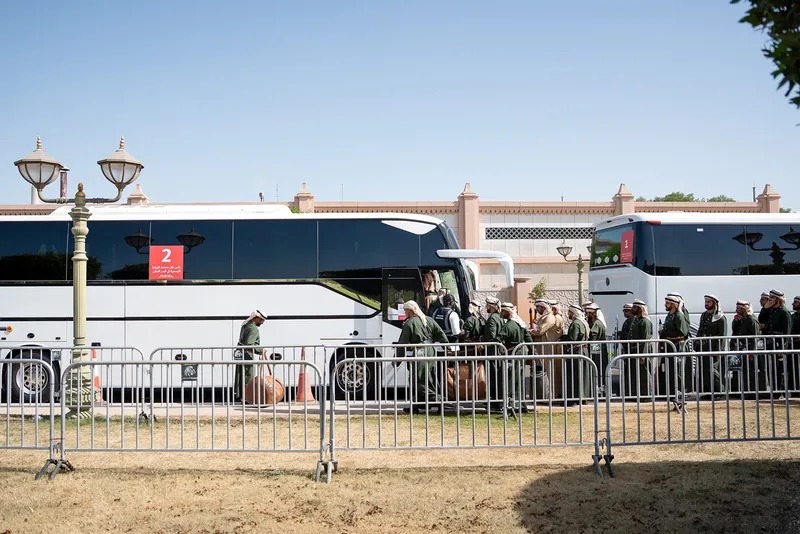 Temporary transport and pedestrian management area with shuttle buses and barriers