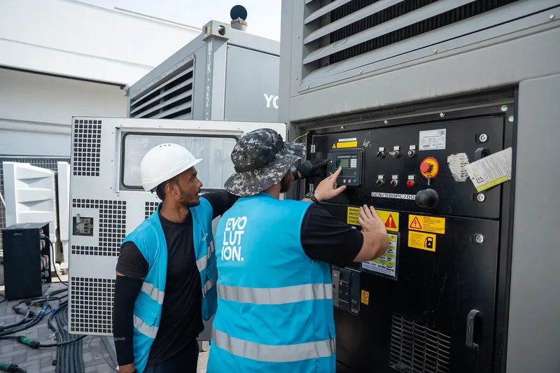 Evolution Site technicians checking temporary power equipment