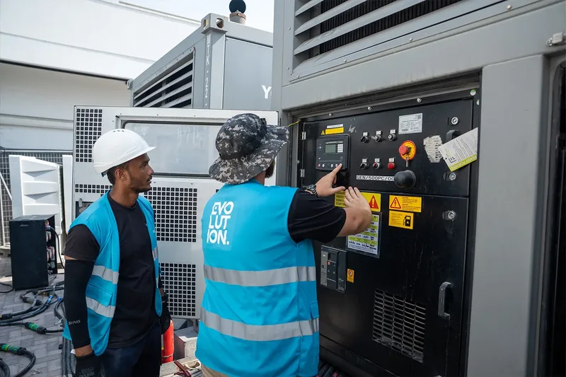 Evolution Site technicians checking temporary power equipment