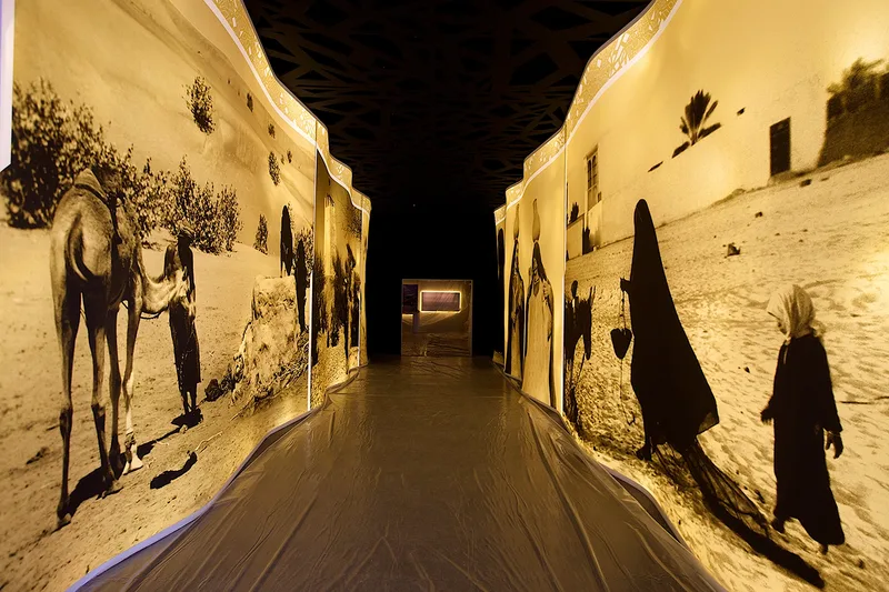 Immersive heritage exhibition corridor with illuminated wall graphics and cultural storytelling.