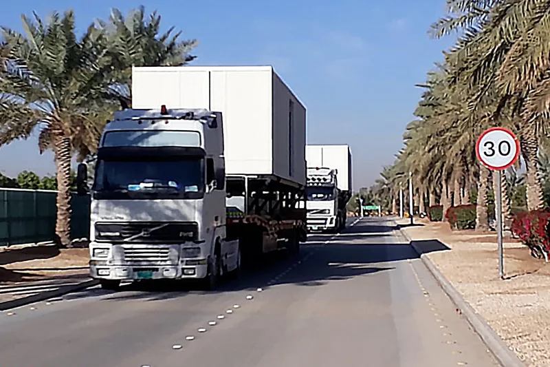 Logistics trucks delivering equipment to an event site