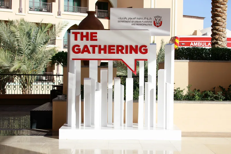 Branded event entrance installation for The Gathering in an outdoor venue setting.