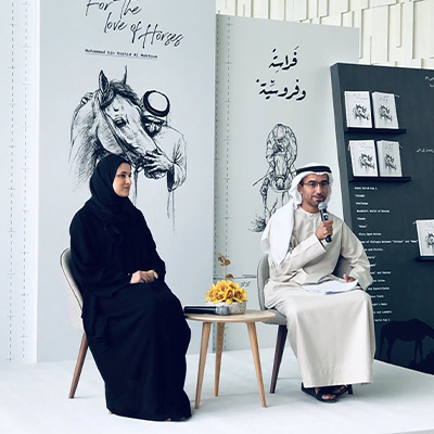 Emirati artists presenting live cultural artwork and heritage storytelling