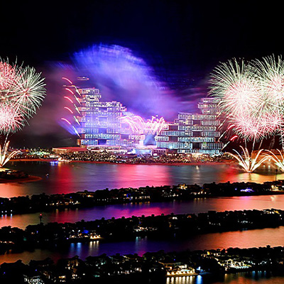 Large-scale launch celebration with fireworks, fountains and live show production
